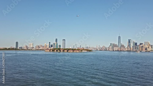 Ellis island and Jersey city view from Hudson river photo