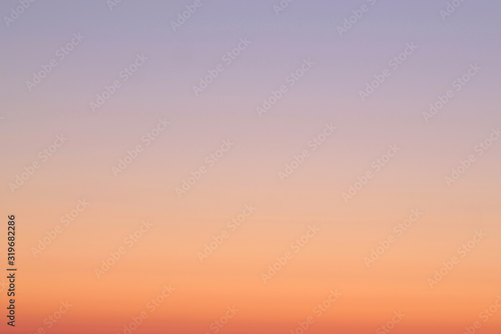 A beautifully backlit colorful sunset sky with the colors of sunrise and sunset.