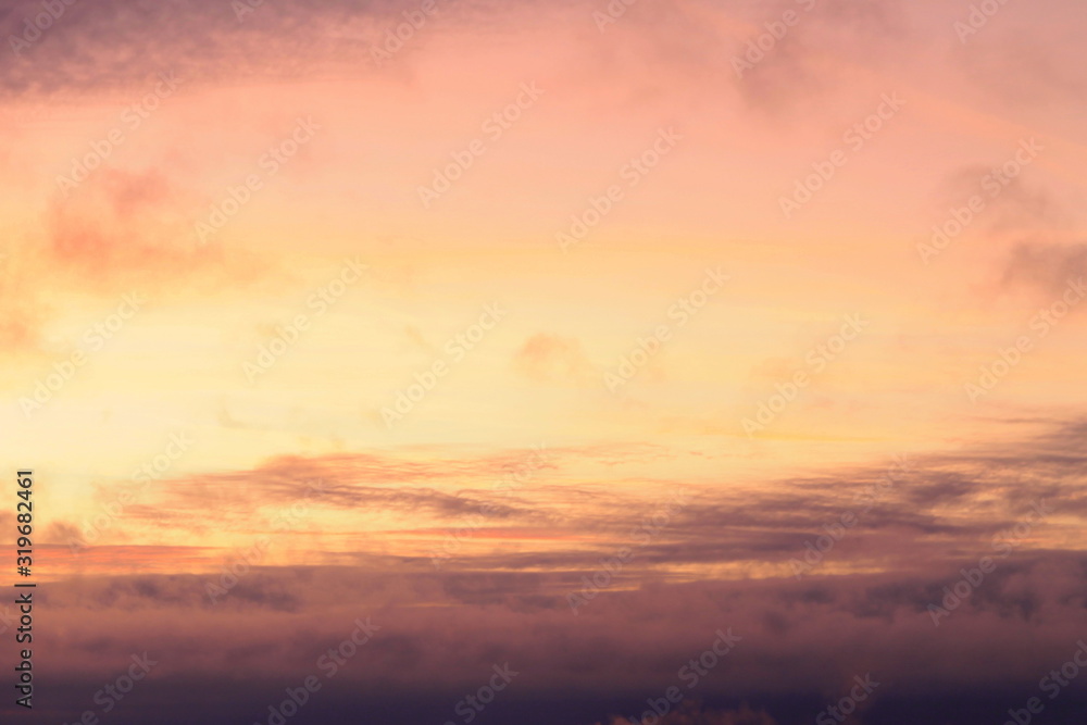 A beautifully backlit colorful sunset sky with the colors of sunrise and sunset.