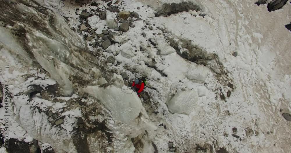 Himalayan mountaineers at Himalaya climbing peaks with high experience & high risk. Professional mountaineers at Himalayas. Ice axe use, pittons use by professional mountaineers. Himalayan mountaineers at Himalaya climbing peaks with high experience & high risk. Professional mountaineers at Himalayas. Ice axe use, pittons use by professional mountaineers.