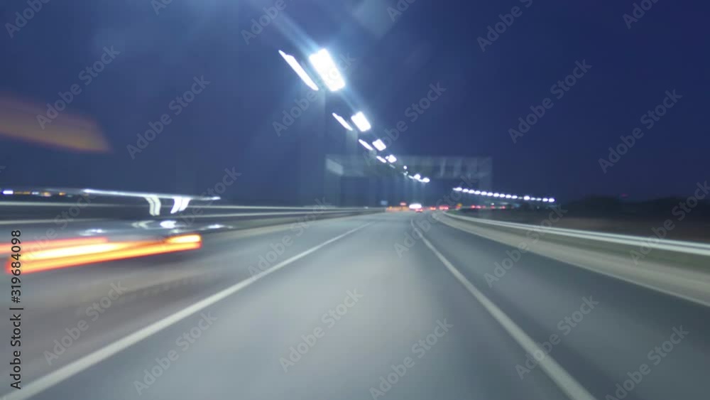 Time Lapse Driving Car On Highway At Dark POV. Hyper Lapse. Evening Sunset Street Lights. Night, Camera In Front, Windshield Reference. Hyperlapse in Evening City, Downtown. POV Futuristic Cityscape. Time Lapse Driving Car On Highway At Dark POV. Hyper Lapse. Evening Sunset Street Lights. Night, Camera In Front, Windshield Reference. Hyperlapse in Evening City, Downtown. POV Futuristic Cityscape.