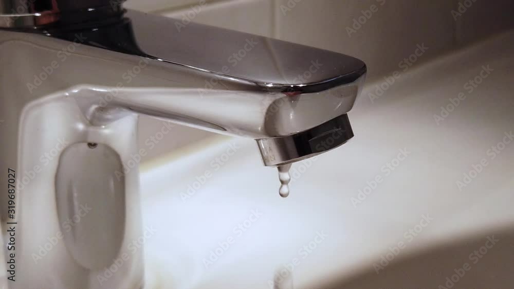 open water tap in a bathroom in slow motion open water tap in a bathroom in slow motion