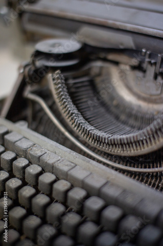 Old, antique typewriter close-up in the dust. © Alena Sharuk
