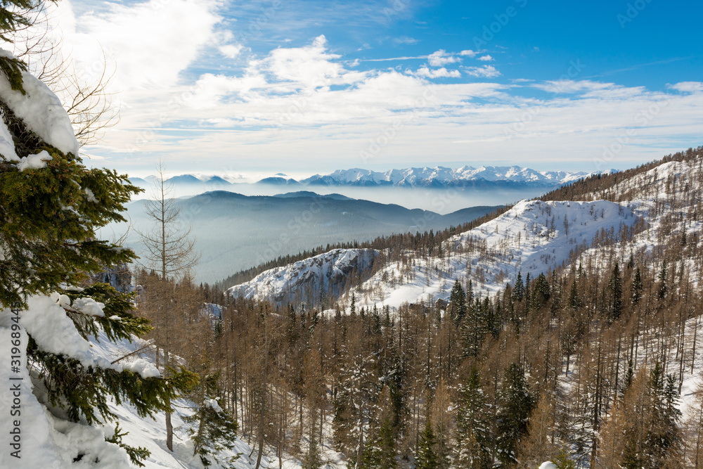 Spectacular winter mountain panorama with snow covered slopes.