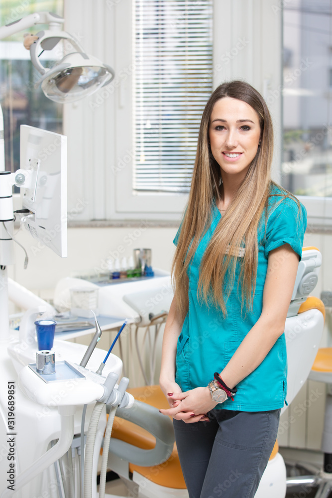 Smiling beautiful woman dental doctor at hospital Smiling beautiful woman dental doctor at hospital