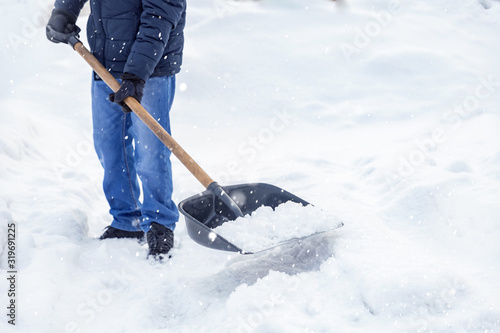 City service cleaning snow winter with shovel after snowstorm yard sunlight © Parilov