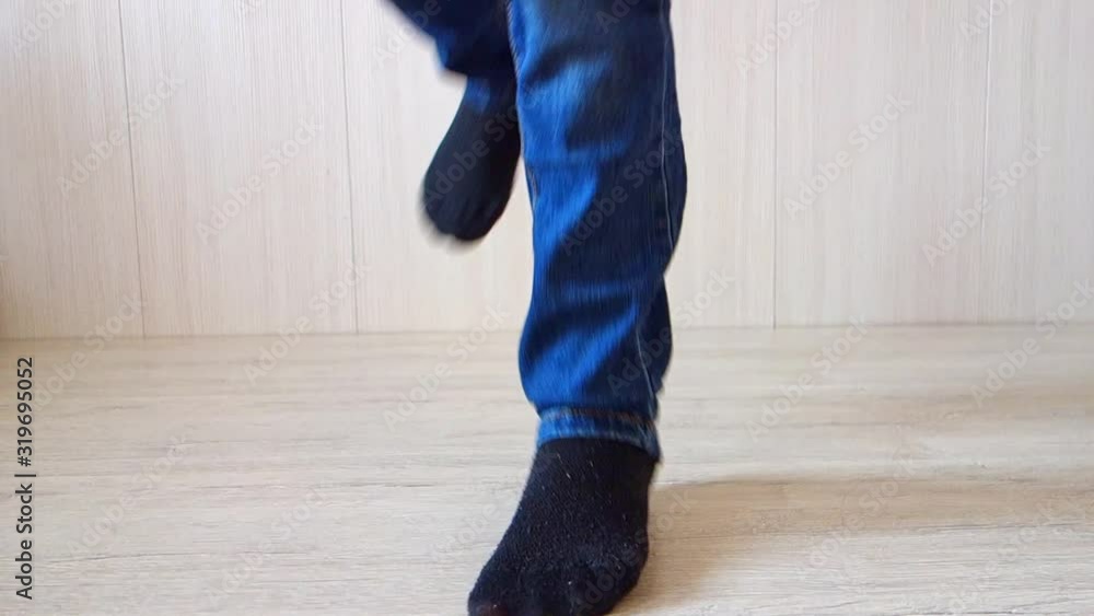 Dancing legs close-up, bottom view. The teenager is dancing. Dancing legs close-up, bottom view. The teenager is dancing.