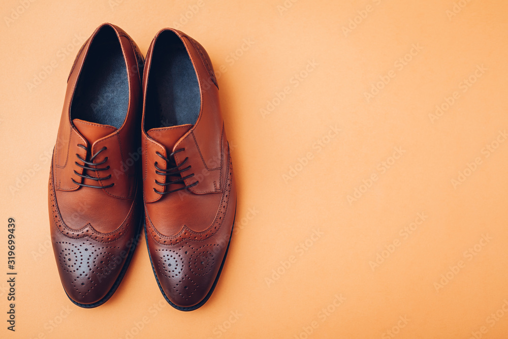 Oxford male brogues shoes. Men's fashion. Classical brown leather footwear.