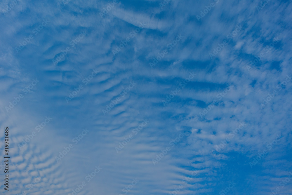 Blue sky with white clouds, (Cirrocumulus clouds) in blue sky on sunny peaceful day. Blue sky with white clouds, (Cirrocumulus clouds) in blue sky on sunny peaceful day.