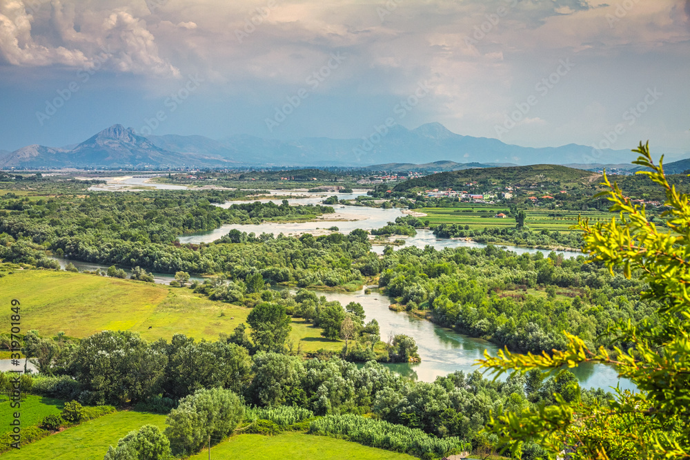 Landscape with river basin and mountain range on background near Shkoder town, Albania, Europe.