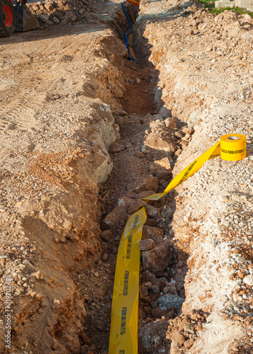 Yellow plastic pipe line for protection fiber optic cable and buried underground