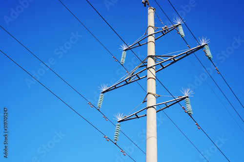 High voltage power line. Volt Amp. Current strength, voltage. Energy for the city. Power transmission technology.