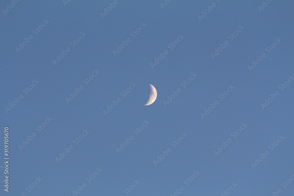 Crescent moon in the skies, wide shot Crescent moon in the skies, wide shot