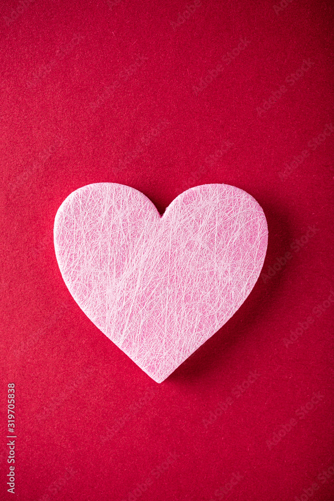 Valentine's Day background. Pink heart over red. Valentines day concept. Flat lay, top view, copy space
