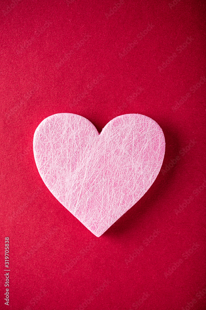 Valentine's Day background. Pink heart over red. Valentines day concept. Flat lay, top view, copy space Valentine's Day background. Pink heart over red. Valentines day concept. Flat lay, top view, copy space