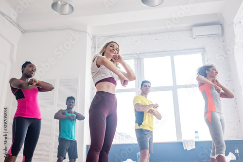 Low angle view of multicultural dancers exercising zumba together in dance studio © LIGHTFIELD STUDIOS