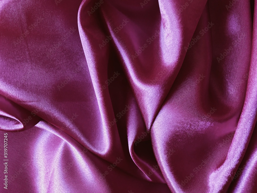 Purple Silk satin fabric texture background, top view.  fabric texture background. wavy canvas pattern. Fabric Tails