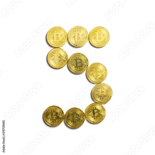 the figure of 5 laid out of bitcoin coins and isolated on white background