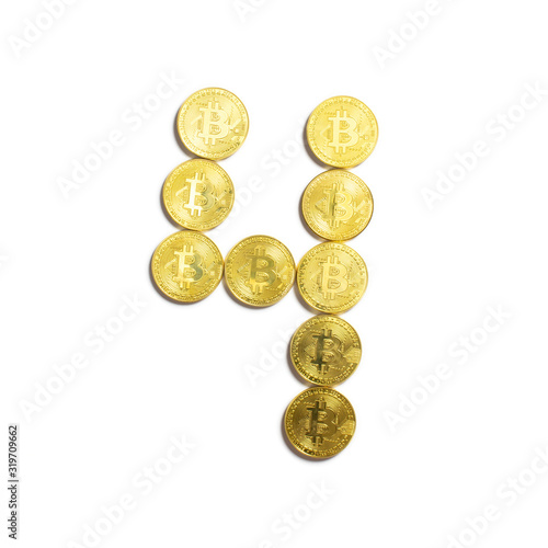 the figure of 4 laid out of bitcoin coins and isolated on white background