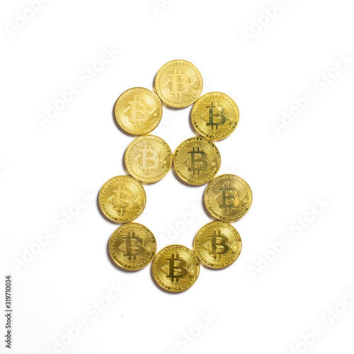 the figure of 8 laid out of bitcoin coins and isolated on white background