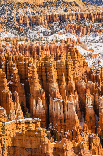 Famous orange hoodoos of Bryce Canyon National Park in winter covered with snow seen from Inspiration Point