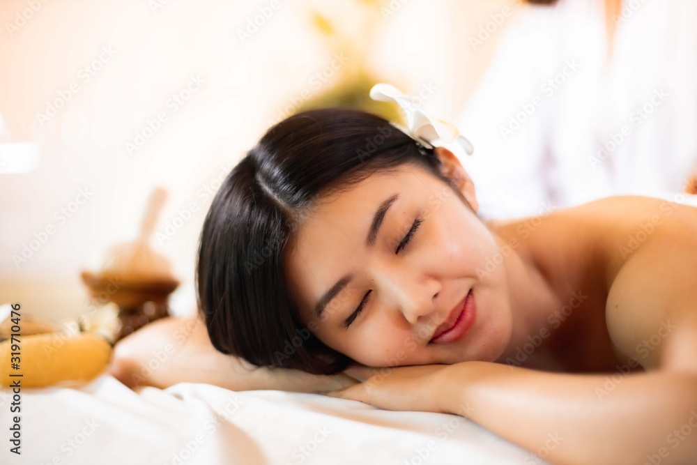 Asian Beautiful, young and healthy woman in spa salon. Massage treatment spa room . Traditional medicine and healing concept. Asian Beautiful, young and healthy woman in spa salon. Massage treatment spa room . Traditional medicine and healing concept.