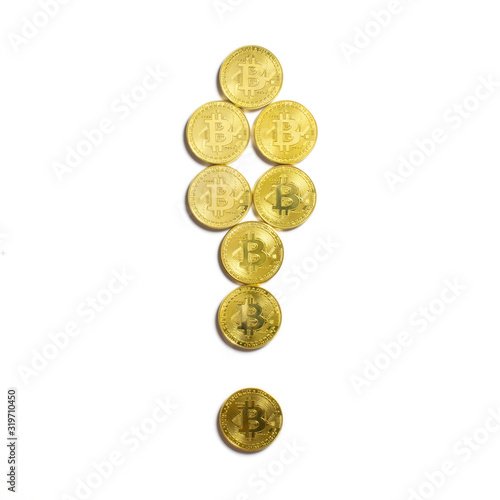 the exclamation symbol laid out of bitcoin coins and isolated on white background