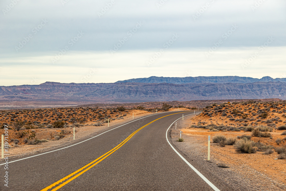 Panoramic shot of an empty road and the arid desert of Valley of Fire State Park, USA
