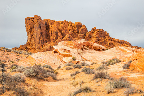 Formations of eroded sandstone and sand dunes in Valley of Fire State Park, USA