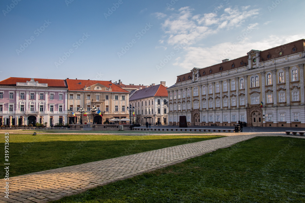 Union square in Timisoara with old historic buildings and churches. Romania, morning, winter day.