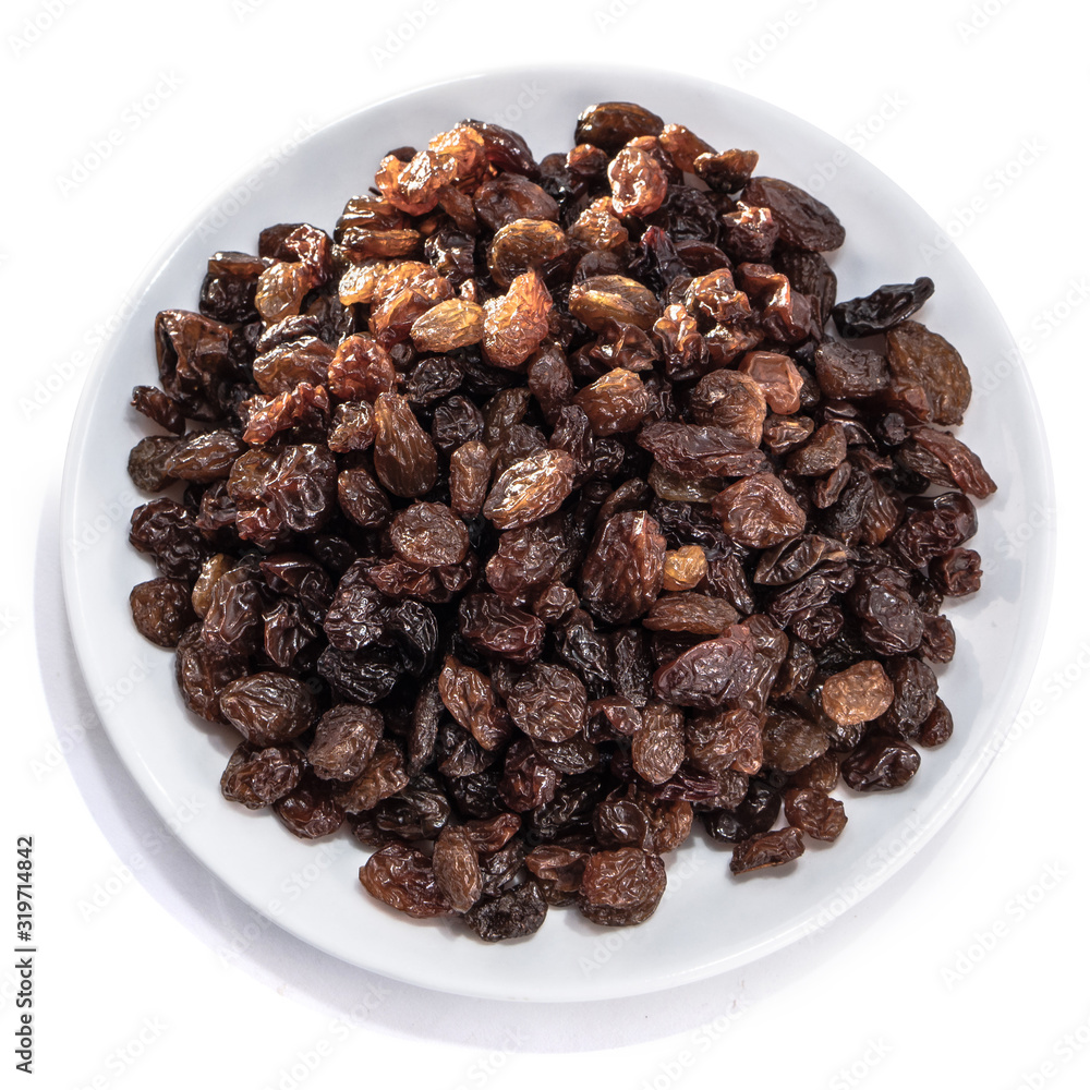 Raisins peeled on a white isolated background. Food grape brown delicious for your design for the site. kitchen theme Raisins peeled on a white isolated background. Food grape brown delicious for your design for the site. kitchen theme