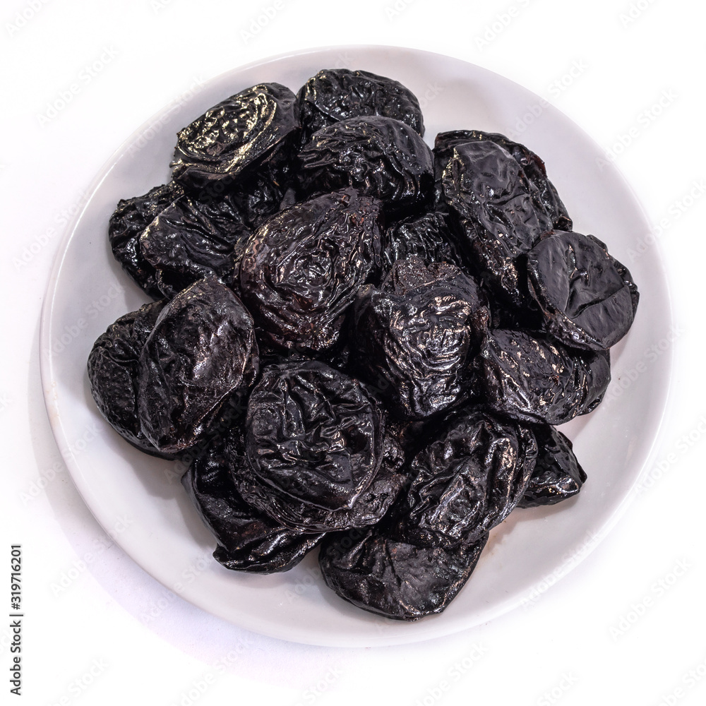 Prunes on a white isolated background. Food for your website design. kitchen theme cuisine and cooking Prunes on a white isolated background. Food for your website design. kitchen theme cuisine and cooking