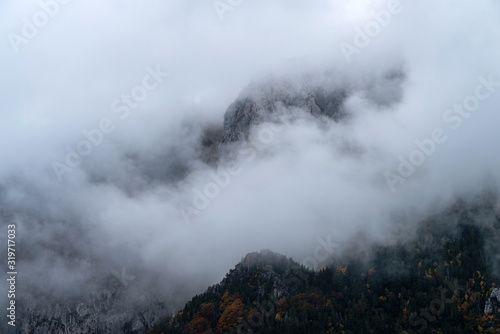 Fog revealing mountain, Italy