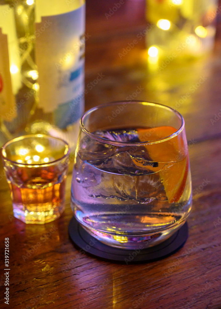 Glass of gin with tonic water, orange and ice Glass of gin with tonic water, orange and ice