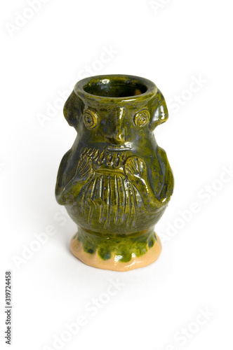 A replica of a medieval face pot