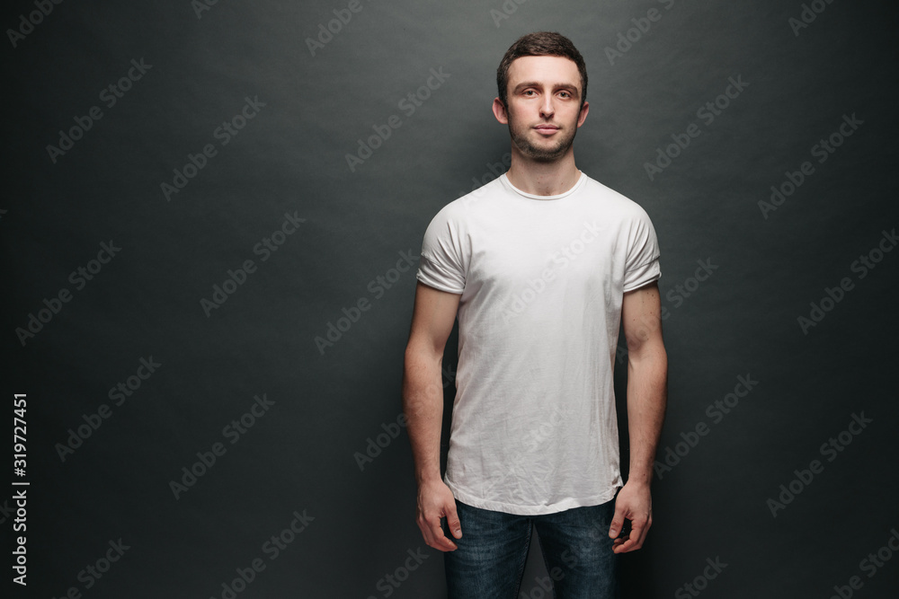 Hipster handsome male model with beard wearing white blank t-shirt