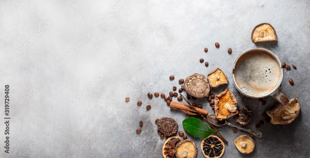 Mushroom coffee, a ceramic cup, mushrooms and coffee beans on stone concrete background. New Superfood Trend. Mushroom coffee, a ceramic cup, mushrooms and coffee beans on stone concrete background. New Superfood Trend.