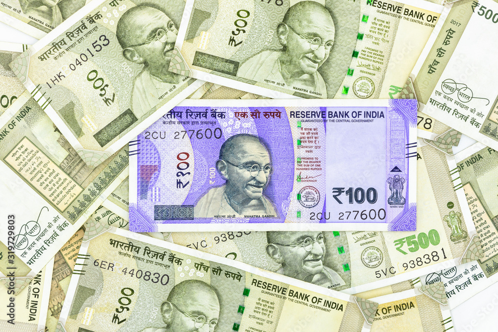 The brand new Indian currency bank notes of 100 and 500 rupees, New Indian Currency  in green envelope on white background, Success and got profit from business