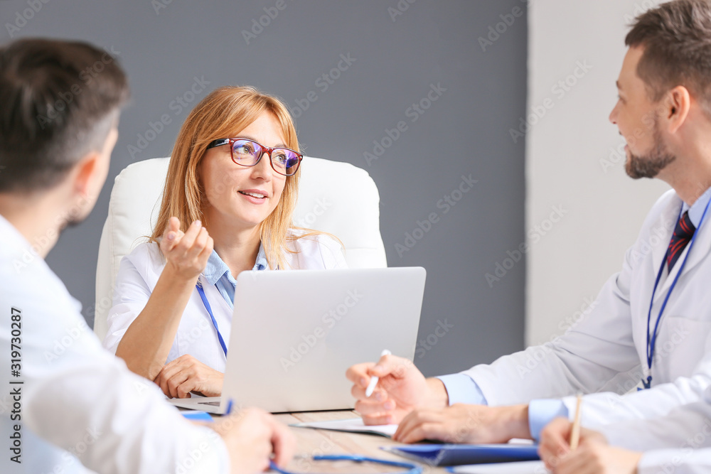 Team of doctors during meeting in clinic Team of doctors during meeting in clinic