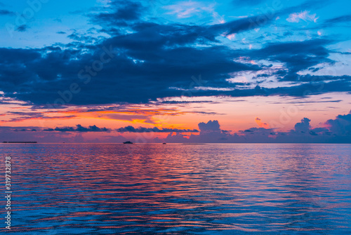 Beautiful Sunset Scenery over the Sea amazing Maldives nature background  amazing multi color cloudy sky with calm sea  Nature landscape background