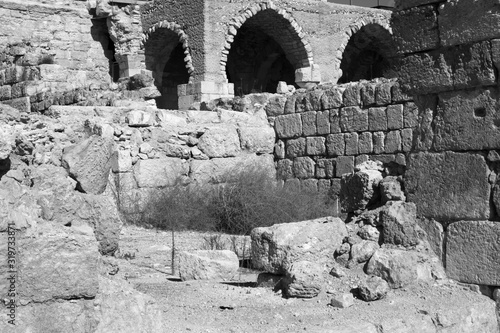 Old Roman city in Israel with arched doorway photo