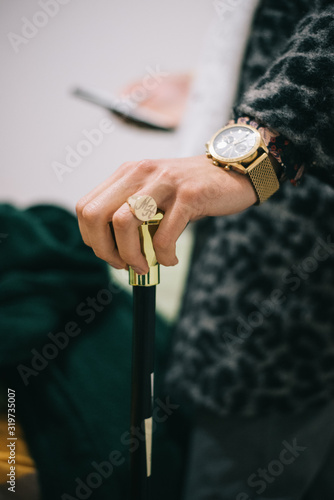 GLD RING GOLD CLOCK ON HAND HOLDING GOLDEN STICK PIMP COSTUME photo