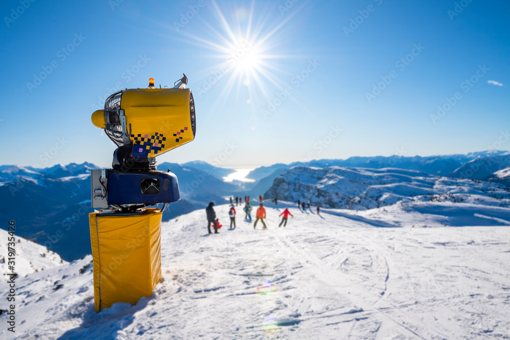 Snowmaker on the ski slopes of the Alps