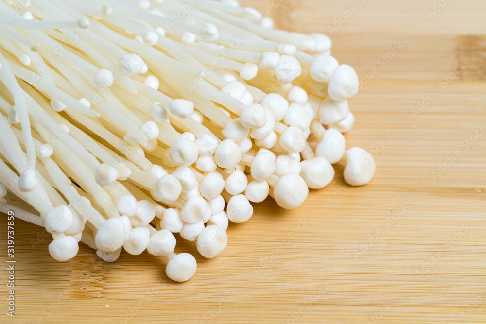 Enoki mushroom or Enokitake that is well known for Japanese cuisine Enoki mushroom or Enokitake that is well known for Japanese cuisine
