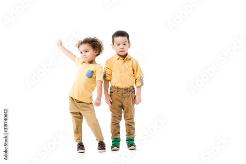 little multiethnic boys standing together isolated on white
