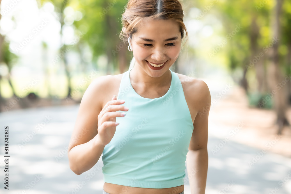 Running Asian woman. Female Runner Jogging during Outdoor Workout in a Park. Asian woman running in garden. Her morning exercise. Running Asian woman. Female Runner Jogging during Outdoor Workout in a Park. Asian woman running in garden. Her morning exercise.