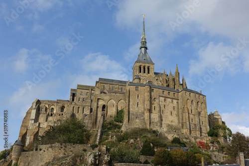 View of the historic Mont Saint Michel, a landmark medieval fortress in Normandy, France.