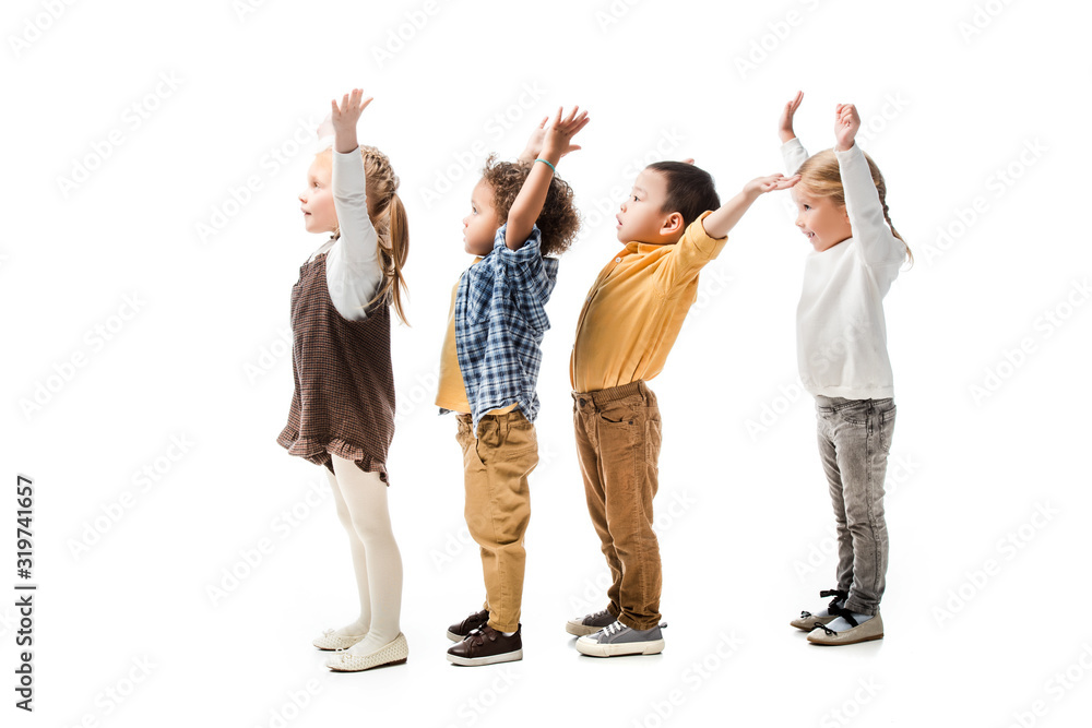 Fototapeta premium cute multiethnic children playing with hands up isolated on white