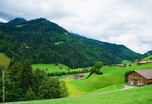 Village of Boltigen with Swiss Alps at Jaun Pass in Fribourg canton, Switzerland. photo