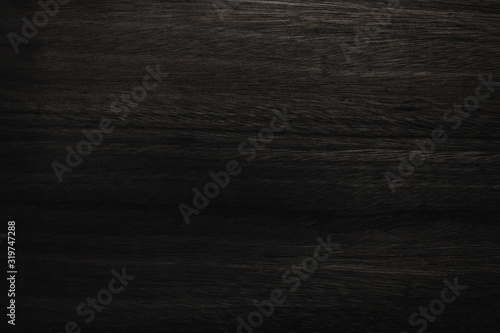 Black wood texture background coming from natural tree. Abstract dark wooden panel with beautiful patterns.Background for interior design. 